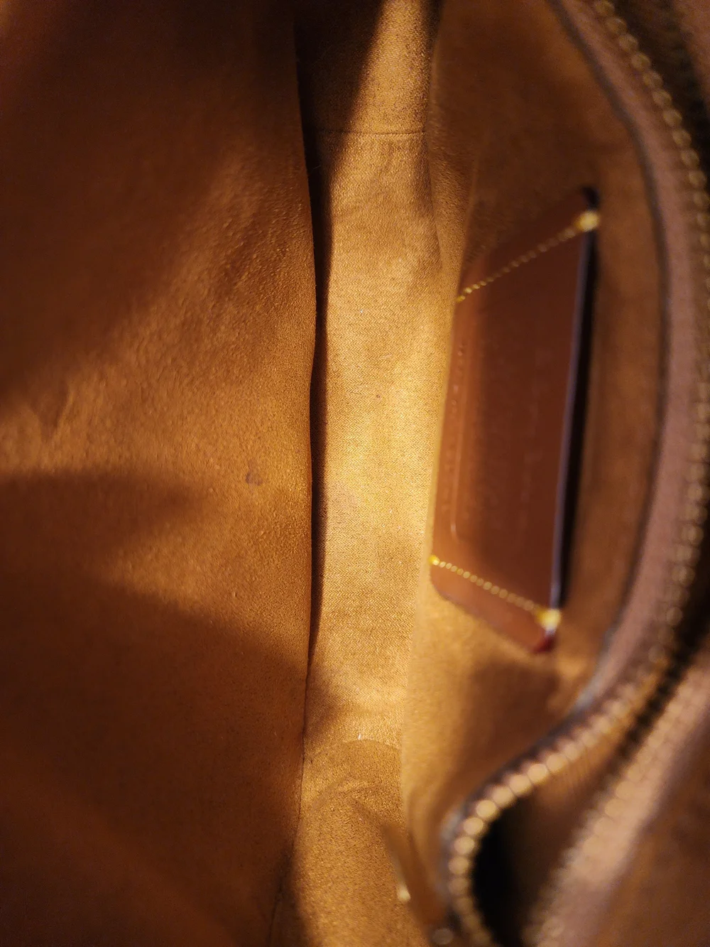 2021 Ivory Coach Beat saddle bag is crafted from glovetanned leather and brass